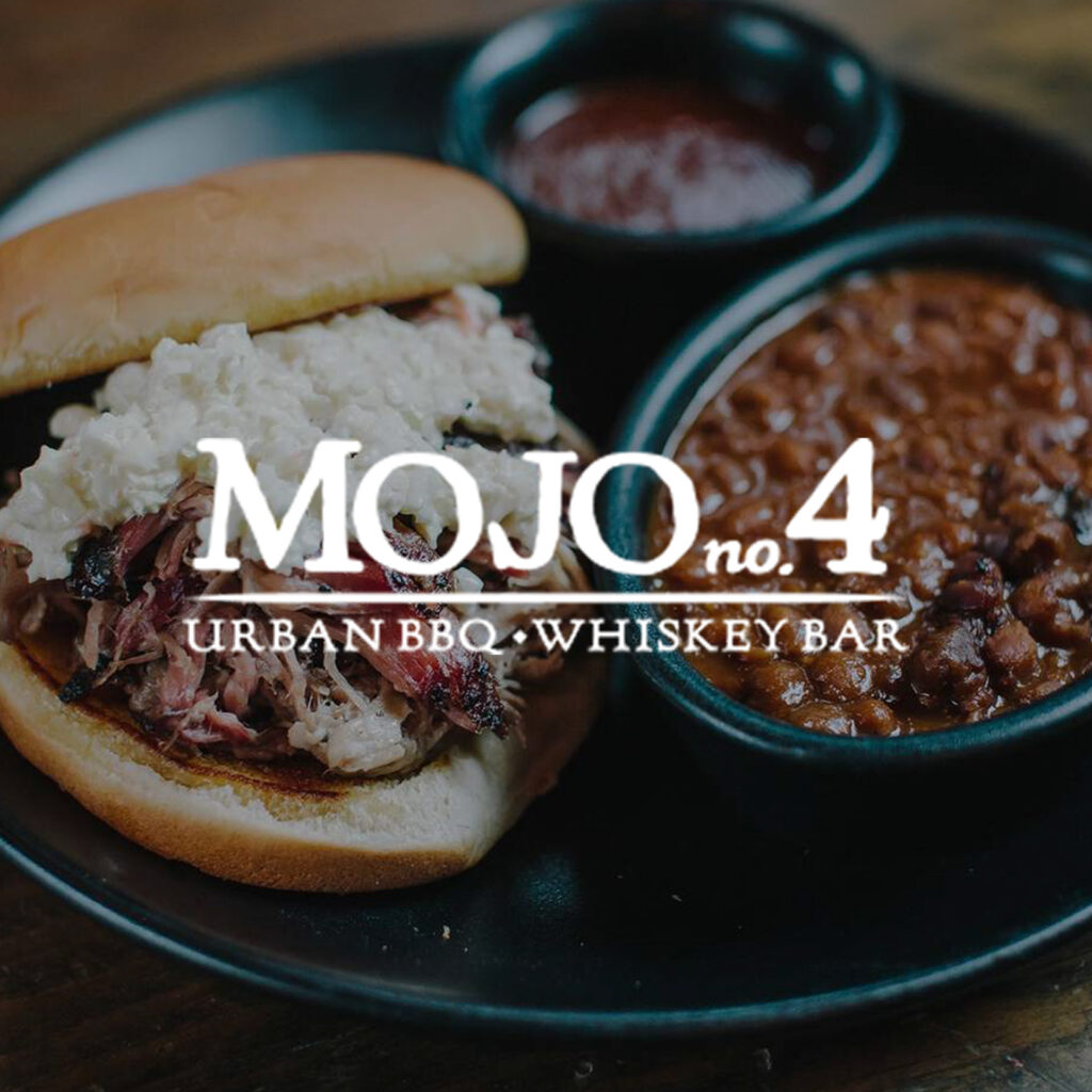 Mojo no 4 over an image of a pulled pork sandwich