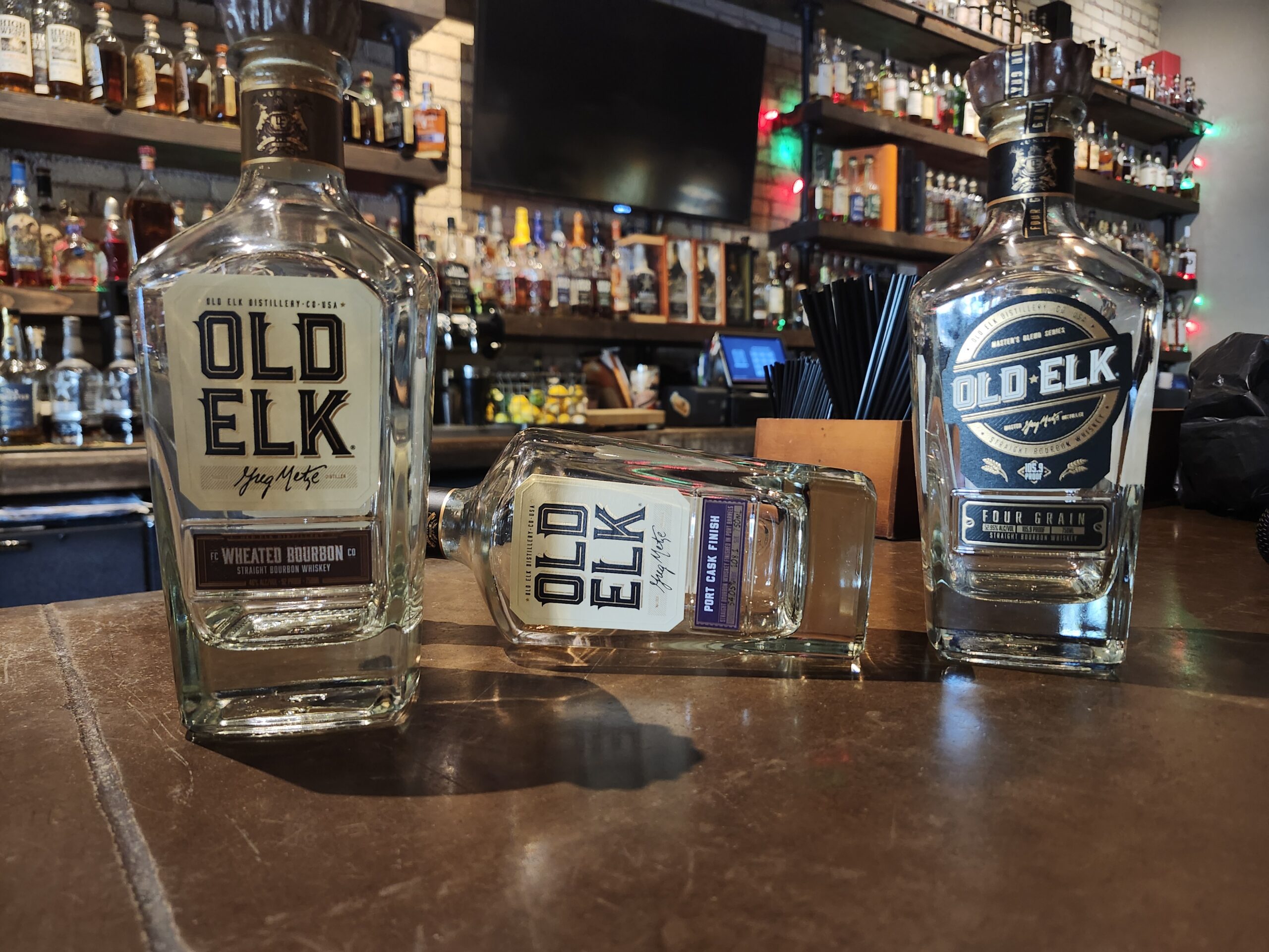 old elk empty bottles staged at whiskey club
