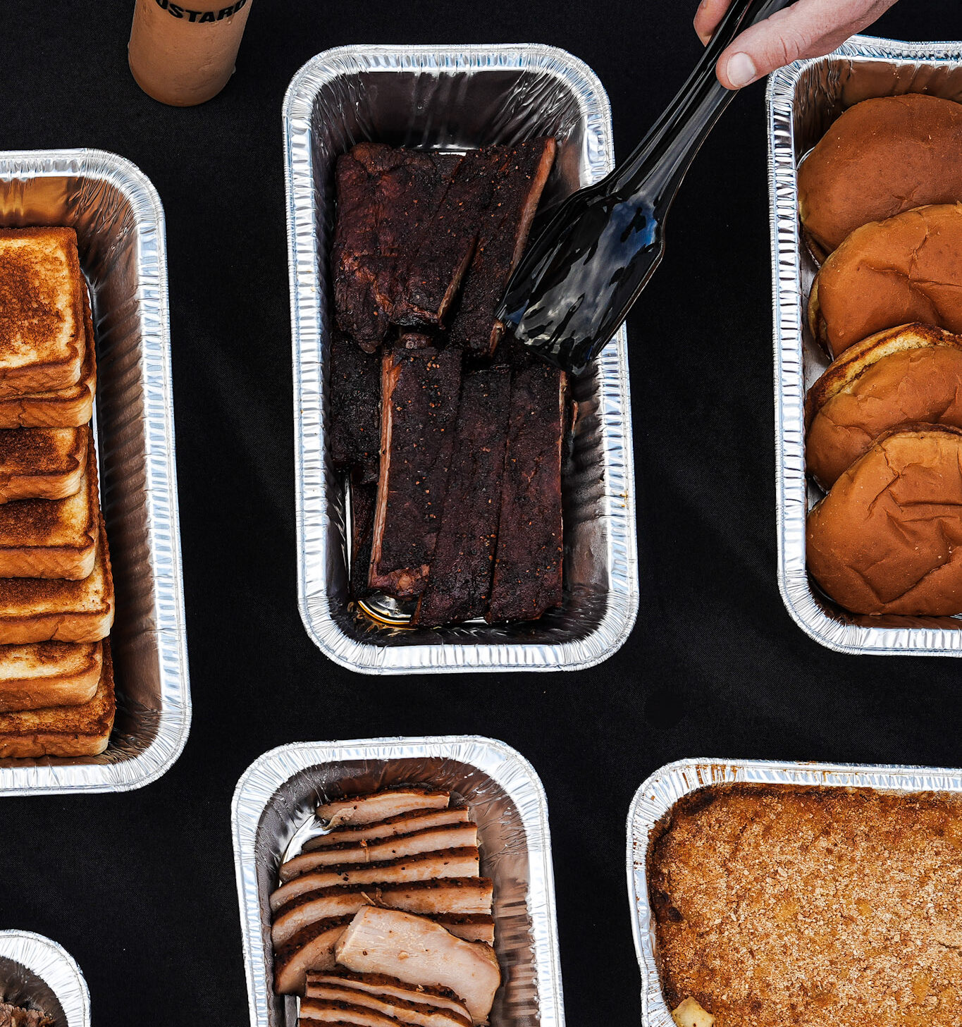 mojo catering close up of ribs, buns, turkey, mac n cheese, and texas toast