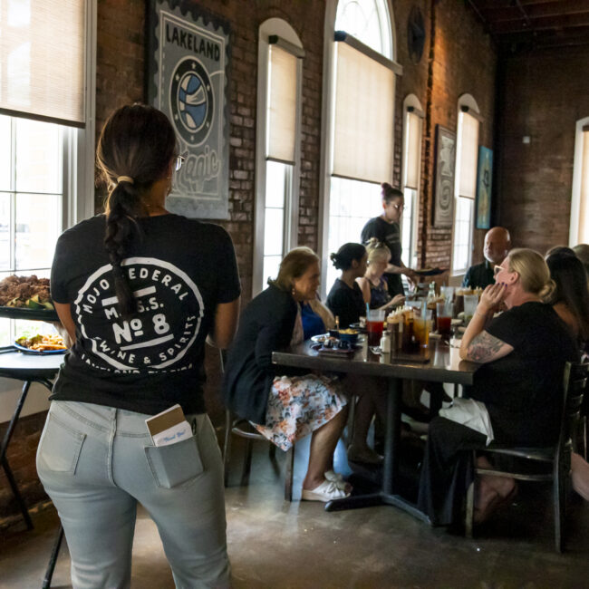 Mojo Federal Interior of a waitress serving food lakeland fl