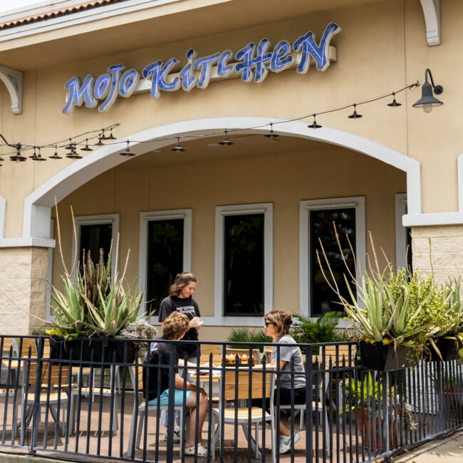 mojo kitchen exterior building with people being served on the patio jacksonvile beach fl
