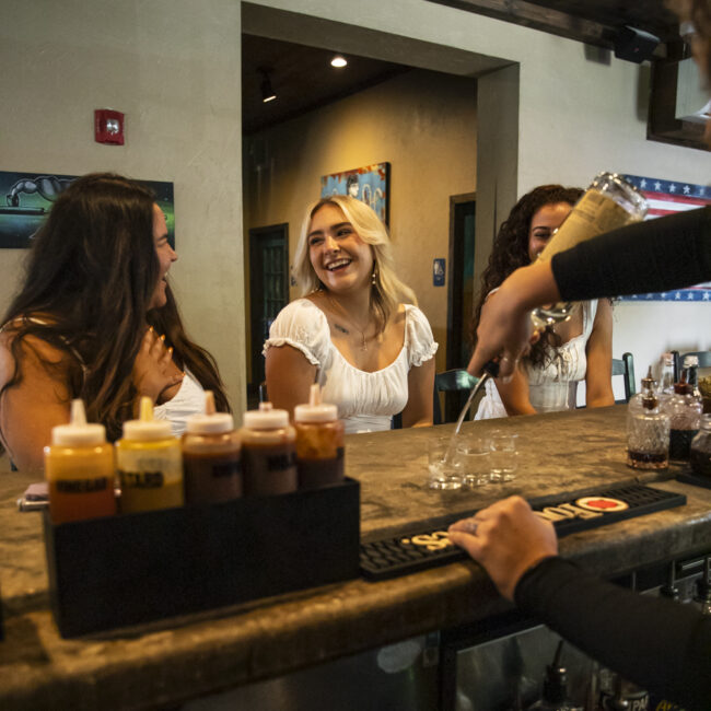 mojo old city bartender pouring a group of girls a shot st augustine, fl